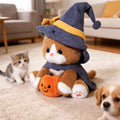 A Soft Toy Cat Adorned with a Wizard'S Hat And Clutching a Pumpkin, Incredibly Charming And Delightful. It Serves As The Perfect Companion for Your Pet, a Buddy for Your Furry, And an Ideal Doll for Engaging with Your Pet